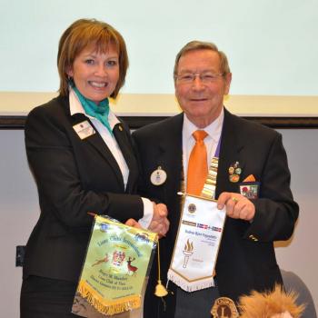 PID Gudrun and DG Roger exchanging banners at District Convention