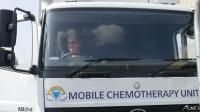 Lion Christine Munday at the wheel of a mobile Chemotherapy unit