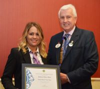 DG David presents his certificate of appreciation to Stephanie Hellier Woods