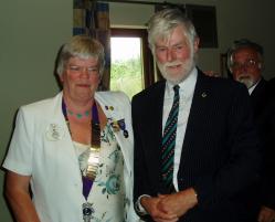 DG Judith congratulates PCC Lion David Hitchins on 45 years of service to Lionism