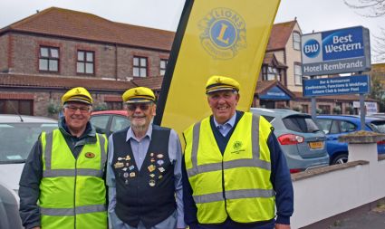 Members of Weymouth and Prtland Lions Club provide an assuring hi vis welcome to the 105D Convention