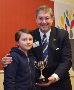 Ned Woodley is presented with the Trophy as District winner of the Peace Poster Competion by Past International Director Phil Nathan